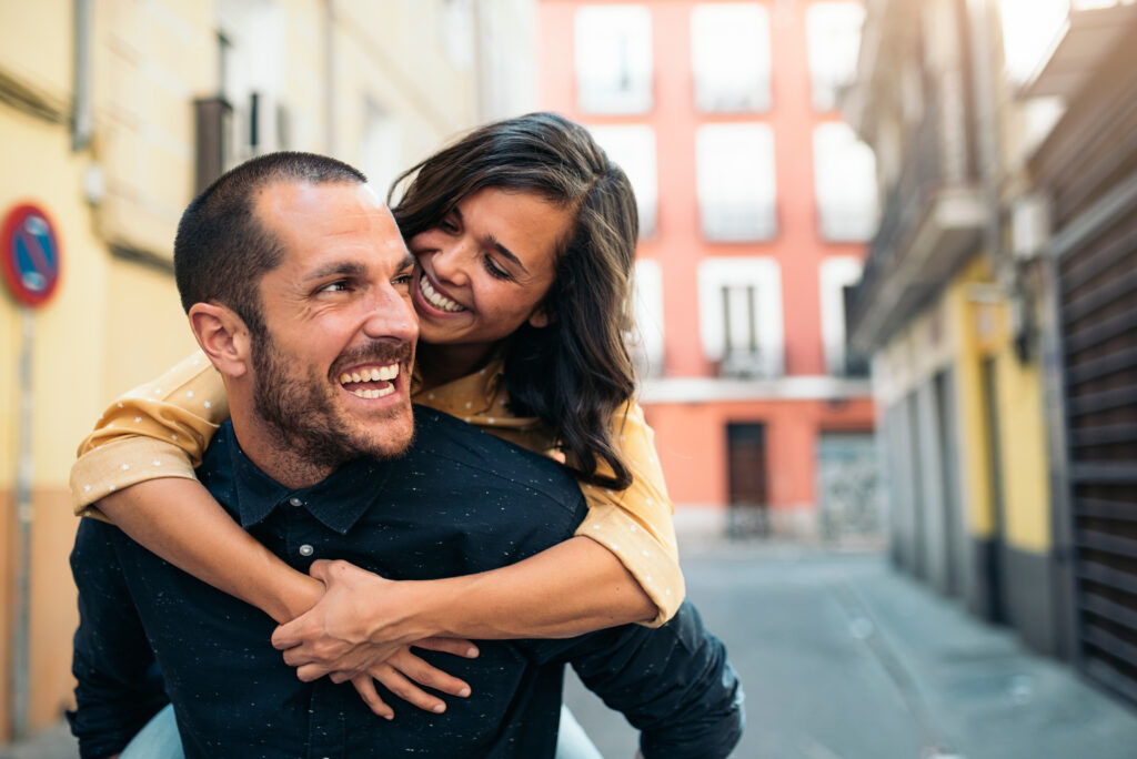 Man giving his partner a piggyback